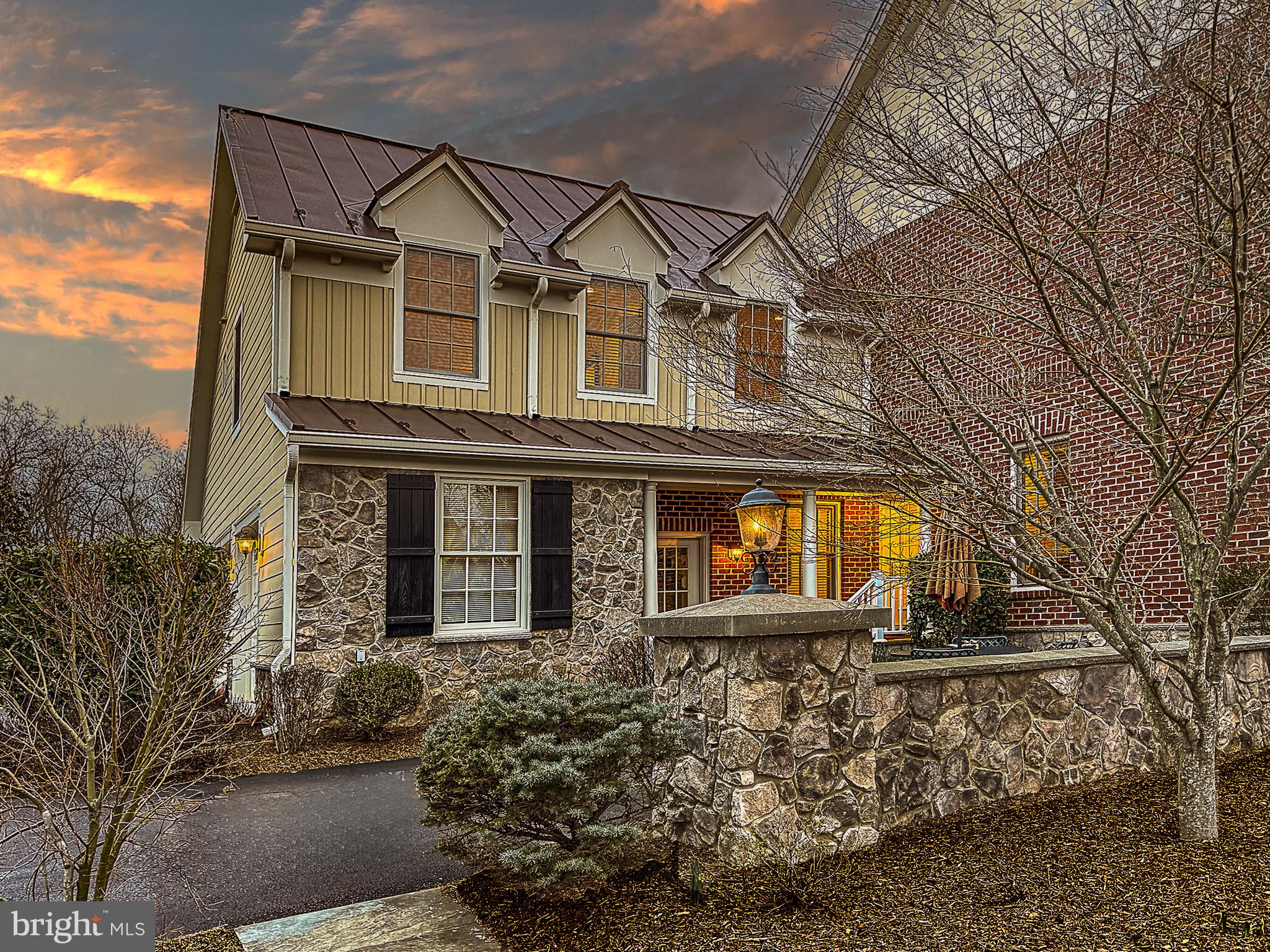 20880 Eckbo Drive Leesburg, VA 20175 - Photo 6 of 10 a front view of a house with a yard