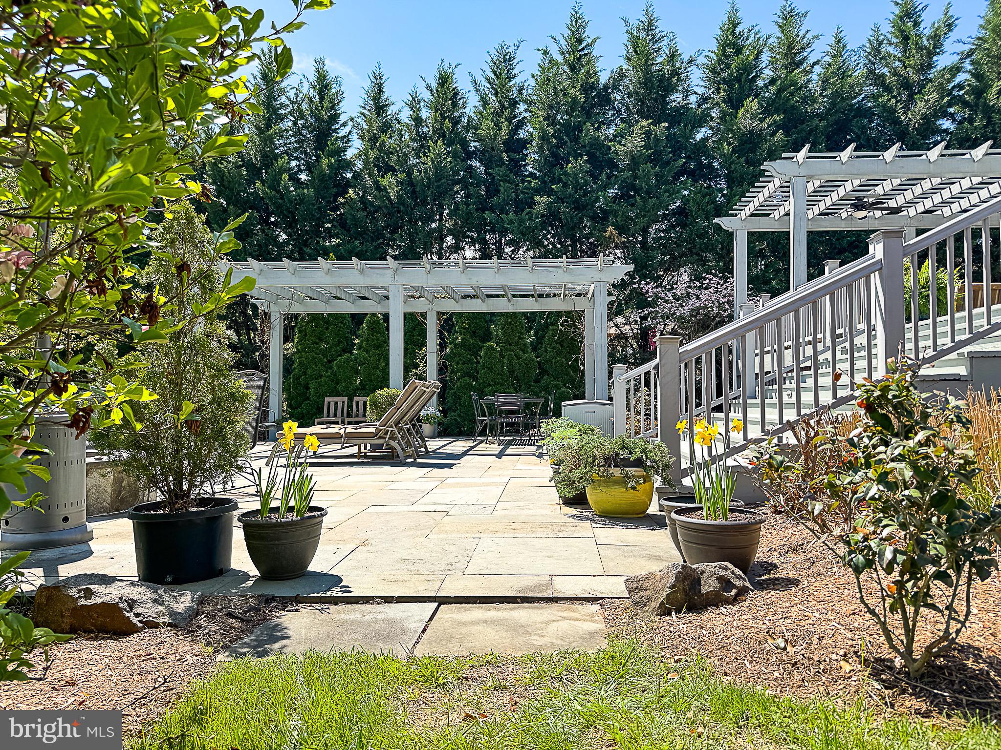 20880 Eckbo Drive Leesburg, VA 20175 - Photo 9 of 10 a view of a house with backyard sitting area and garden