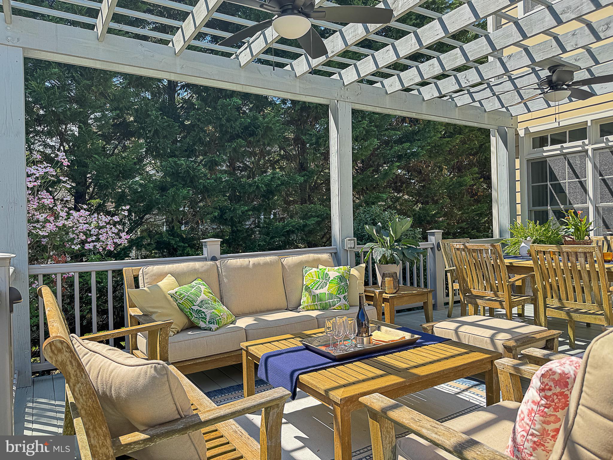 20880 Eckbo Drive Leesburg, VA 20175 - Photo 10 of 10 a view of a patio with couches chairs and wooden floor