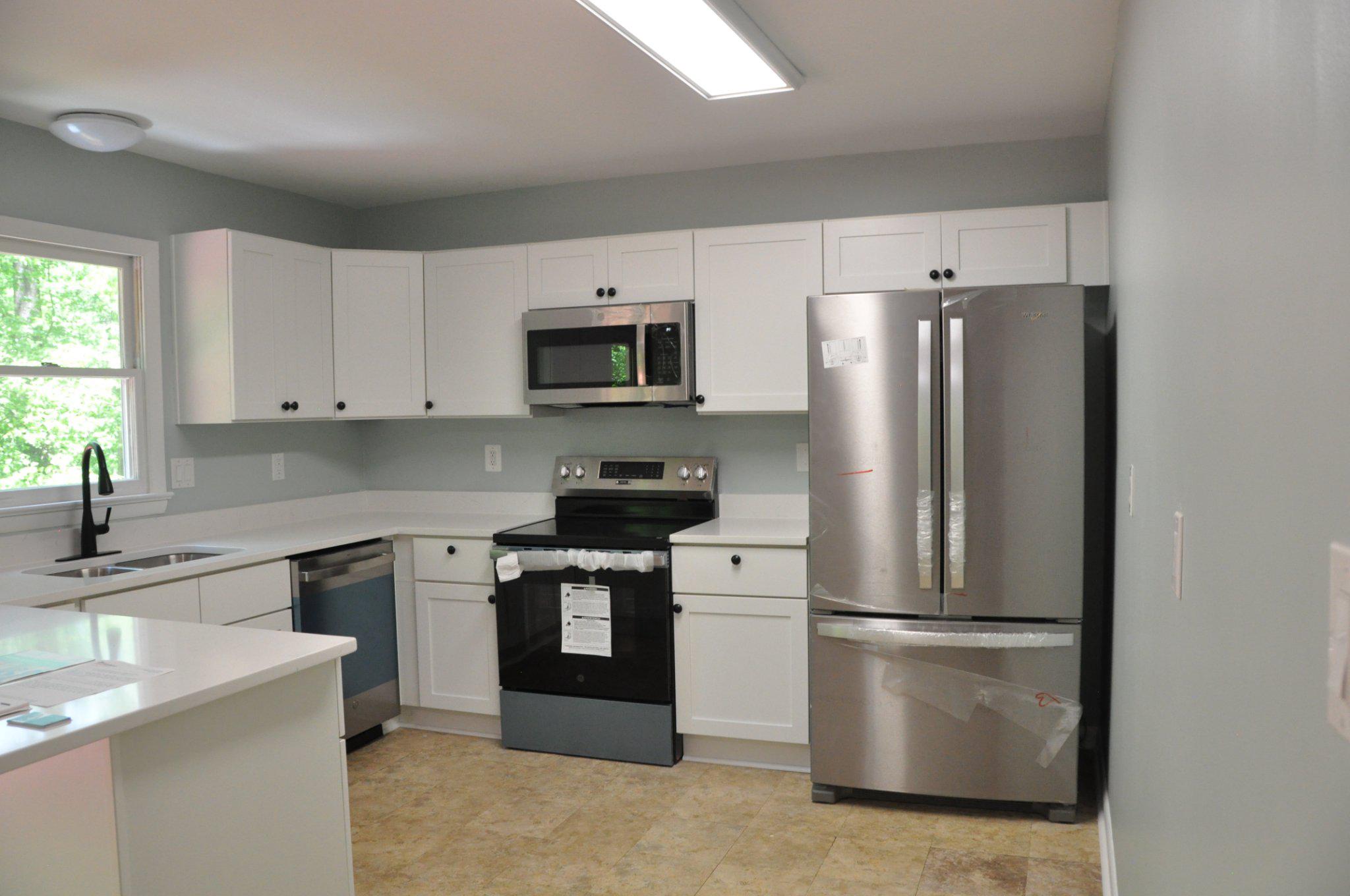 28 Henry Way Linden, VA 22642 - Photo 8 of 39 a kitchen with stainless steel appliances a refrigerator stove microwave and sink
