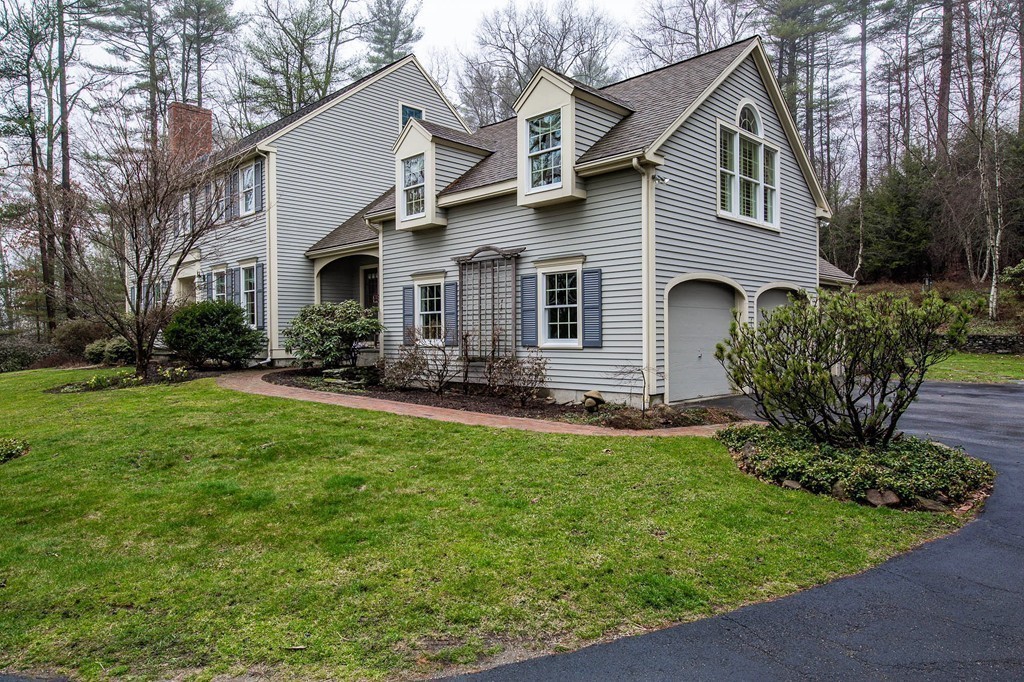 25 Chandler Road Boxford, MA 01921 - Photo 2 of 30 a front view of a house with a yard and outdoor seating