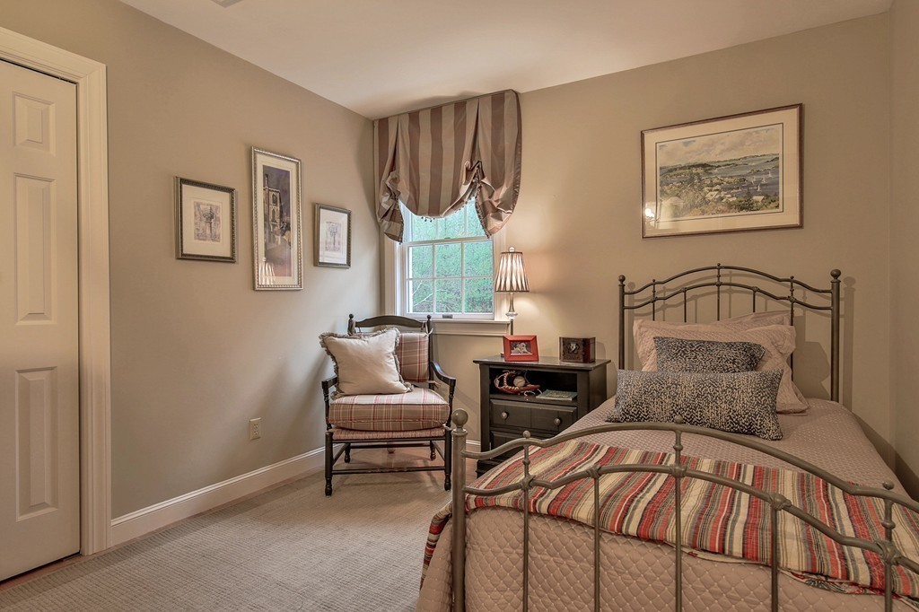 25 Chandler Road Boxford, MA 01921 - Photo 21 of 30 a bedroom with a bed and chair