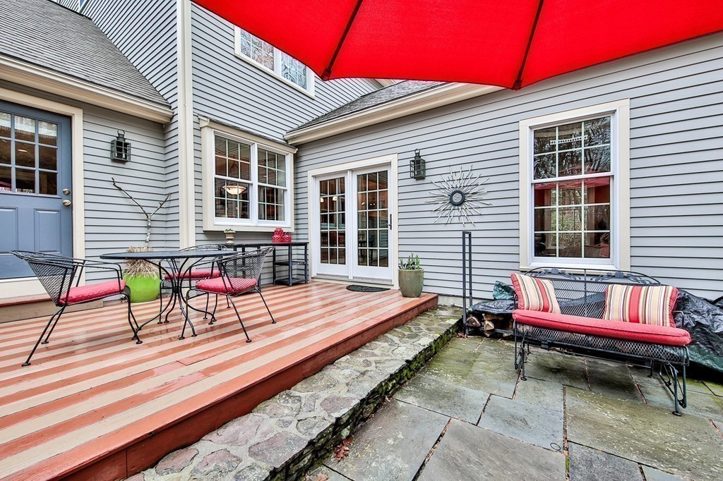 25 Chandler Road Boxford, MA 01921 - Photo 29 of 30 a backyard of a house with outdoor seating