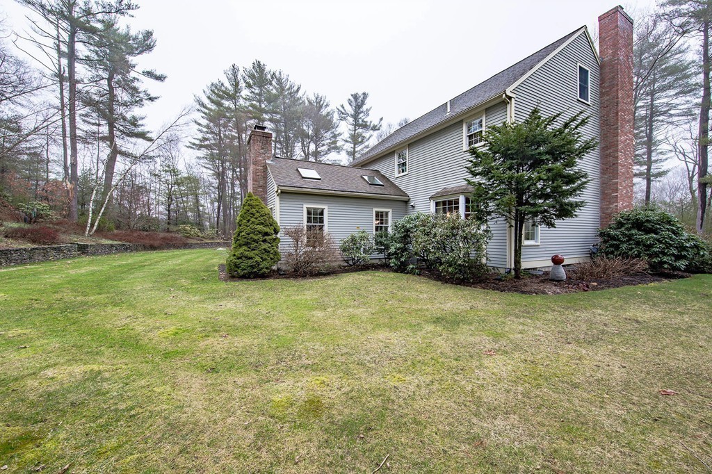 25 Chandler Road Boxford, MA 01921 - Photo 30 of 30 a house with trees in front of it