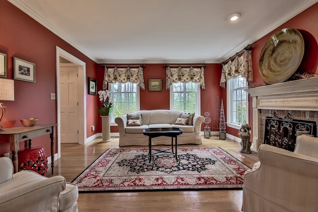 25 Chandler Road Boxford, MA 01921 - Photo 5 of 30 a living room with fireplace furniture and a large window
