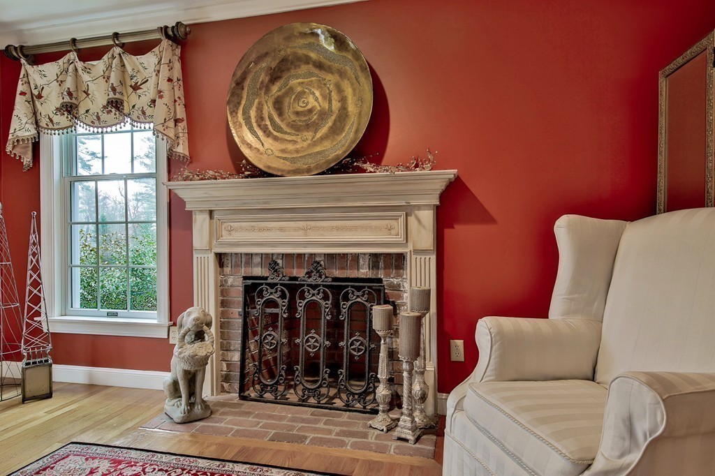 25 Chandler Road Boxford, MA 01921 - Photo 6 of 30 a living room with furniture a flat screen tv and a fireplace
