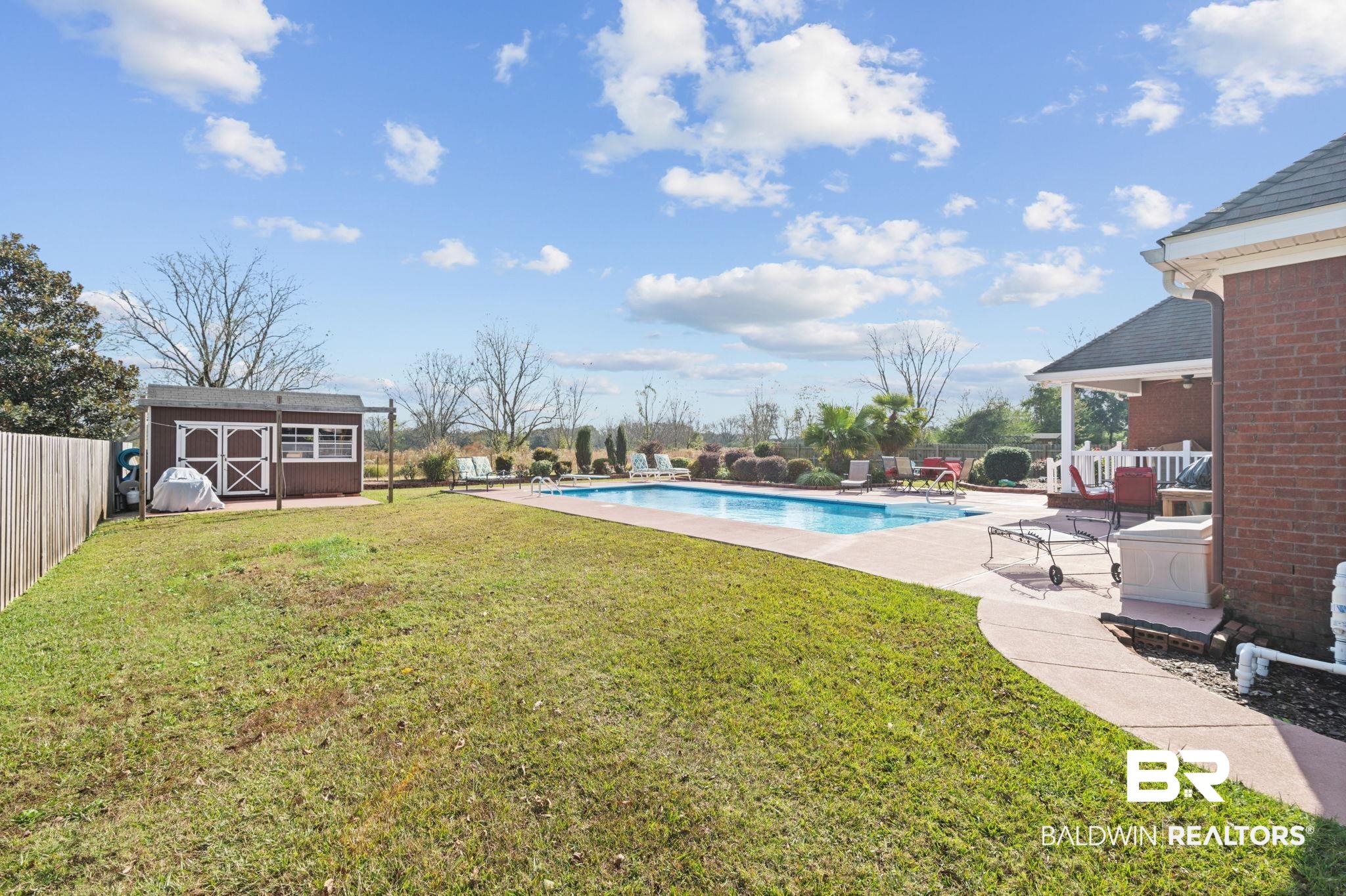 4771 Pecan Ridge East Mobile, AL 36619 - Photo 8 of 48 View of pool featuring a patio area, a fenced backyard, and a storage unit