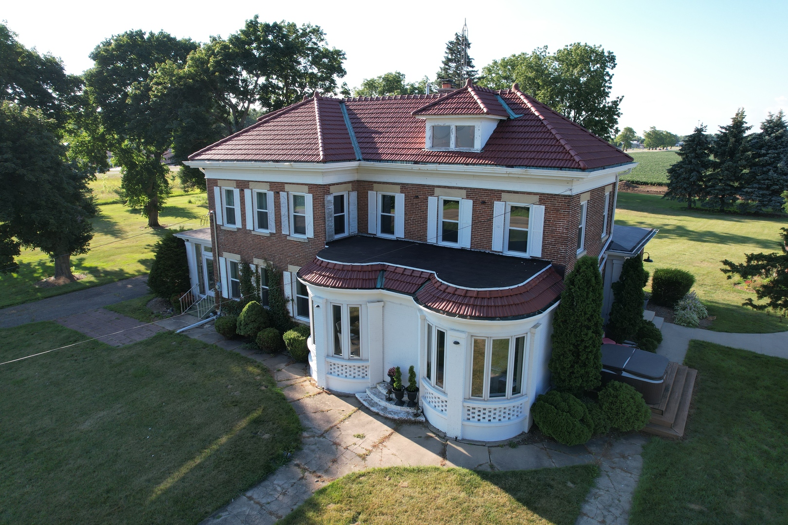 14676 East Twombly Road Rochelle, IL 61068 - Photo 1 of 63 a front view of a house with garden