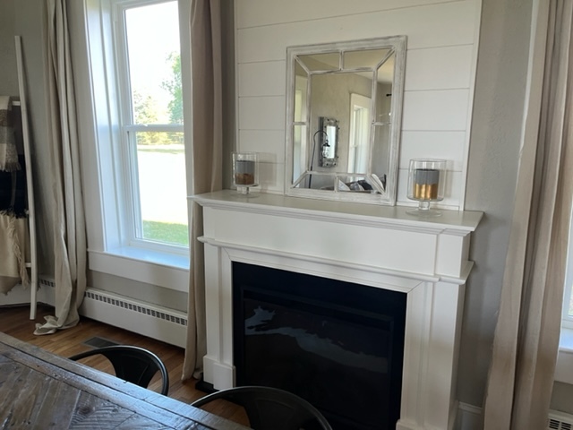 14676 East Twombly Road Rochelle, IL 61068 - Photo 14 of 63 a view of living room with a fireplace and windows