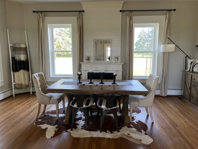 14676 East Twombly Road Rochelle, IL 61068 - Photo 17 of 63 a view of a dining room with furniture and wooden floor