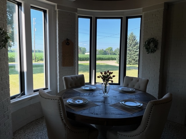 14676 East Twombly Road Rochelle, IL 61068 - Photo 27 of 63 a view of a dining room with furniture window and wooden floor