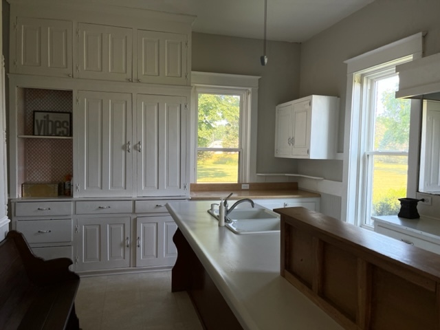 14676 East Twombly Road Rochelle, IL 61068 - Photo 30 of 63 a kitchen with stainless steel appliances granite countertop a sink a stove cabinets and a window