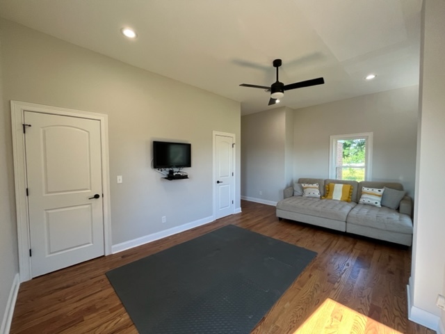 14676 East Twombly Road Rochelle, IL 61068 - Photo 39 of 63 a living room with a couch and a flat screen tv