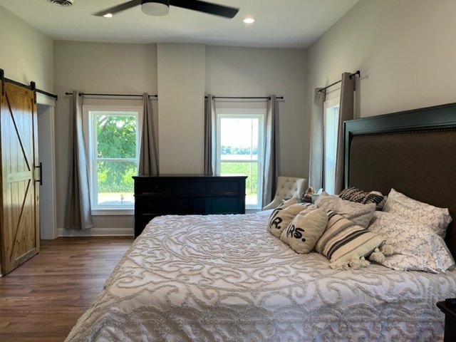 14676 East Twombly Road Rochelle, IL 61068 - Photo 44 of 63 a bedroom with a bed and a large mirror