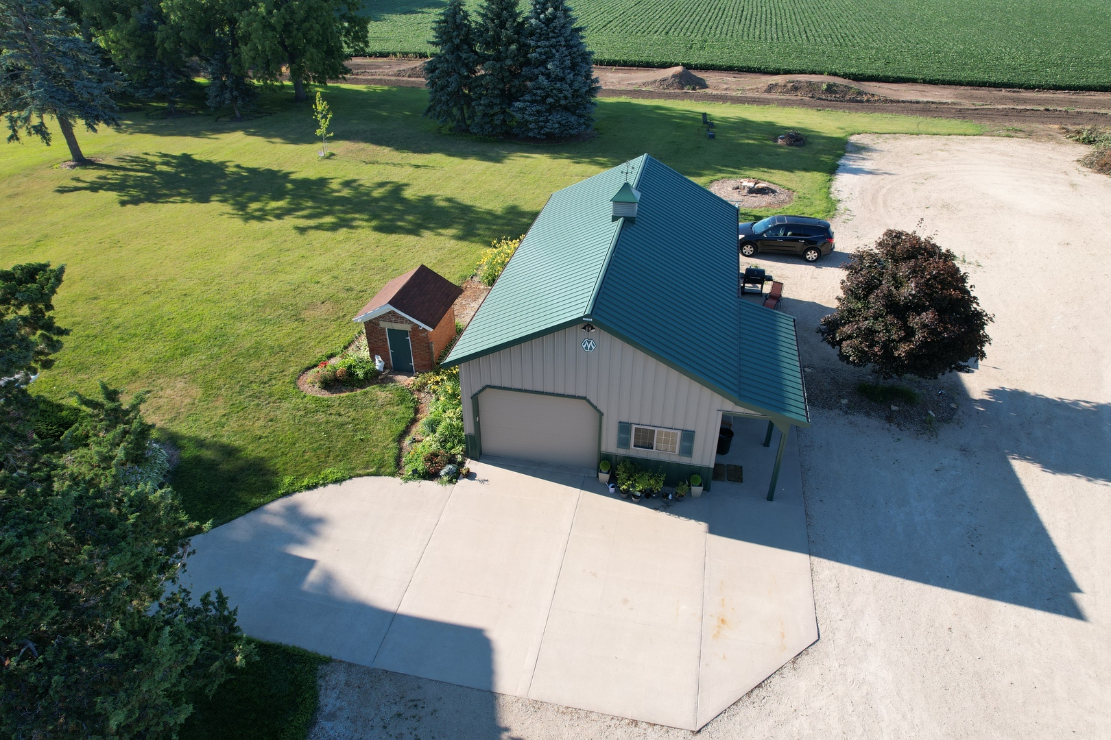 14676 East Twombly Road Rochelle, IL 61068 - Photo 58 of 63 an aerial view of a house with a yard basket ball court and outdoor seating