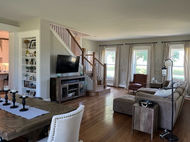 14676 East Twombly Road Rochelle, IL 61068 - Photo 10 of 63 a living room with furniture and a flat screen tv