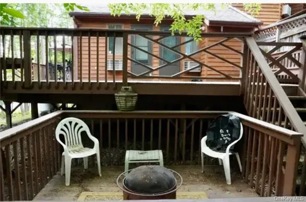 a view of balcony with wooden floor and a potted plant