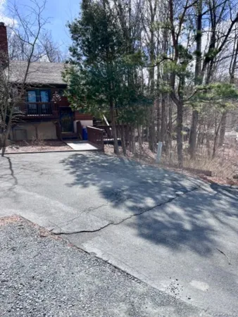 a view of a backyard with sitting area