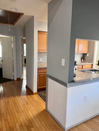 a view of a kitchen from the hallway