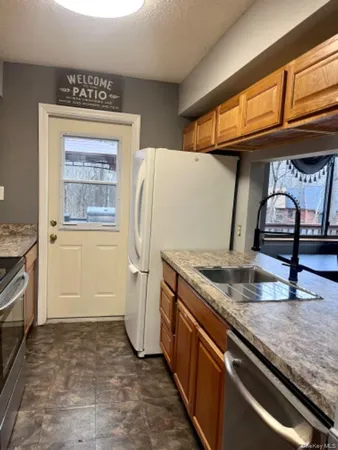 a kitchen with a refrigerator and countertop