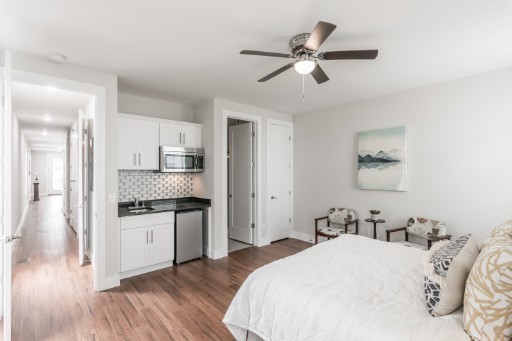 5904 B Morrow Road Nashville, TN 37209 - Photo 5 of 21 a bed room with a bed and ceiling fan