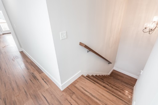 5904 B Morrow Road Nashville, TN 37209 - Photo 9 of 21 a view of a hallway with wooden floor and stairs