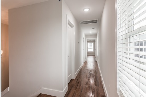 5904 B Morrow Road Nashville, TN 37209 - Photo 10 of 21 a view of a hallway with wooden floor and staircase