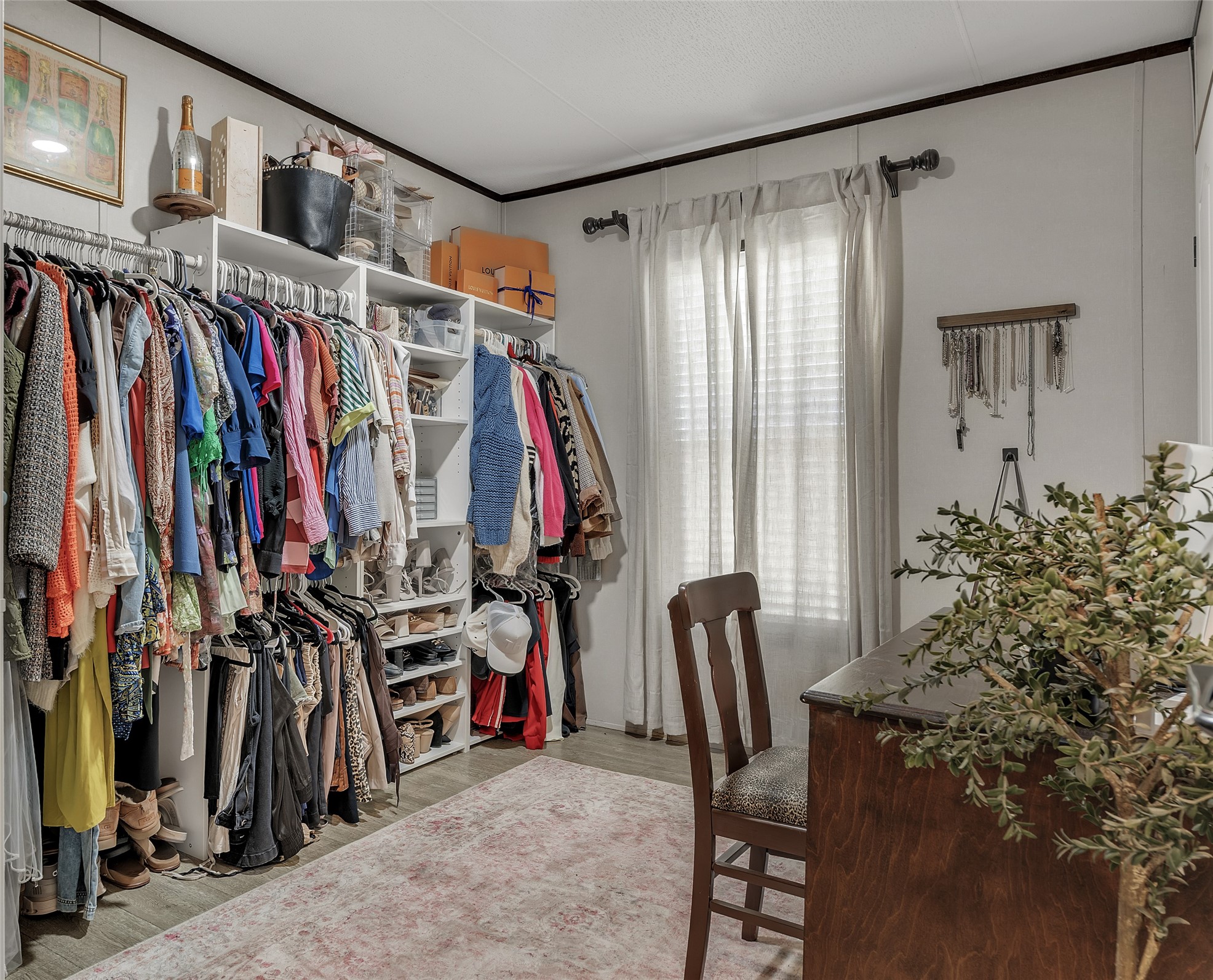 3133 Henderson Road Navasota, TX 77868 - Photo 22 of 26 a view of walk in closet with clothes