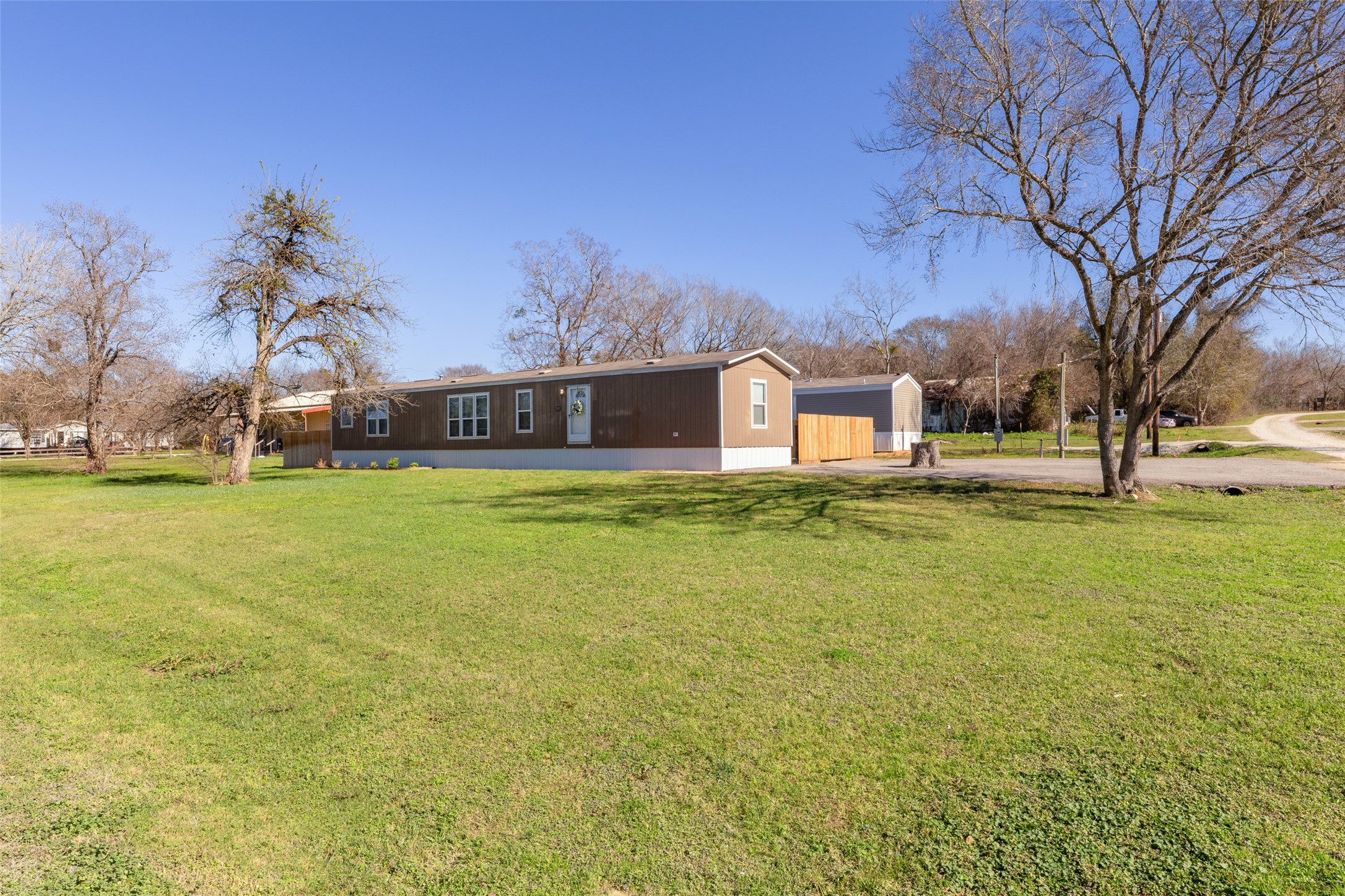 3133 Henderson Road Navasota, TX 77868 - Photo 3 of 26 a view of a swimming pool with an outdoor space and seating area