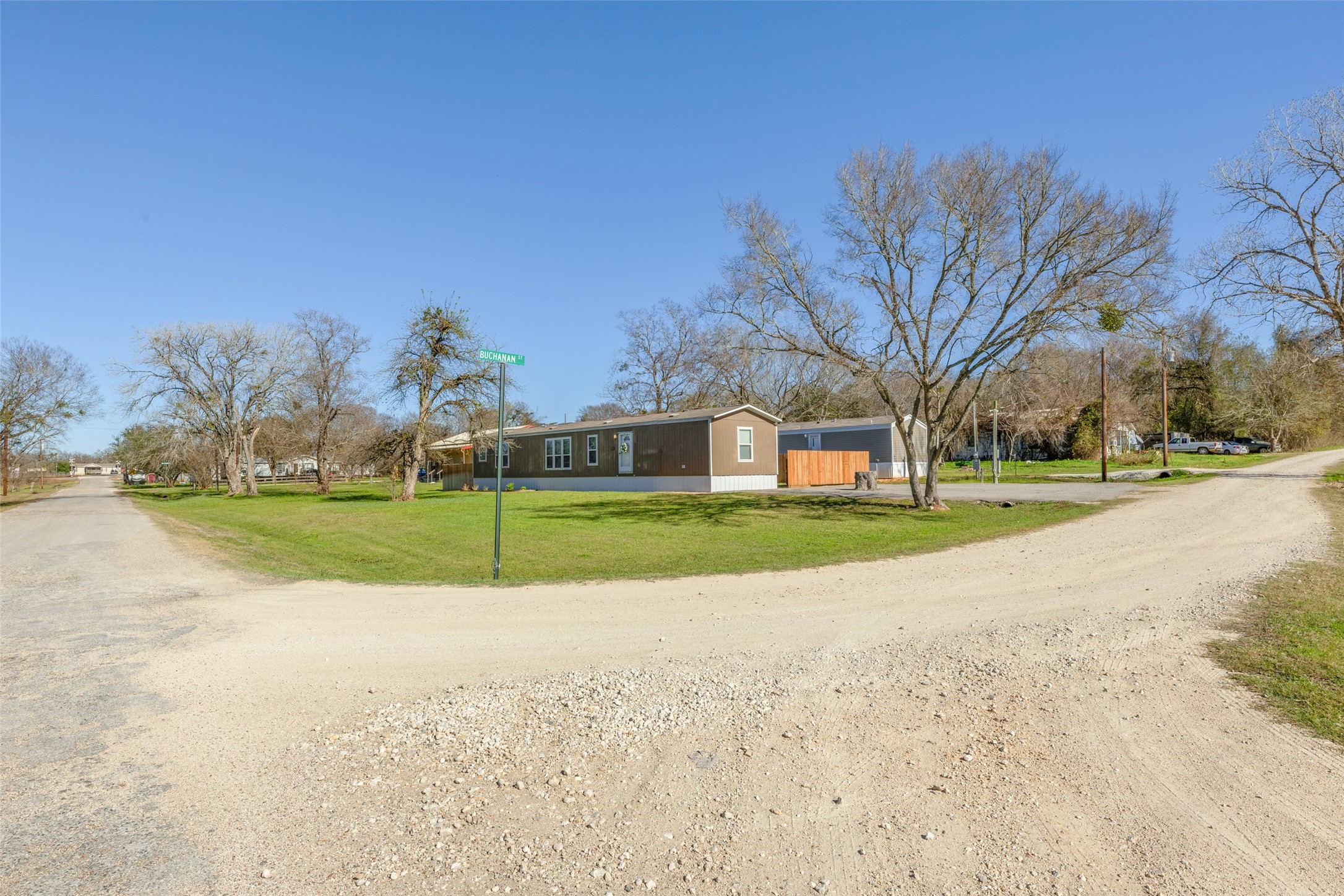 3133 Henderson Road Navasota, TX 77868 - Photo 4 of 26 a view of a house with a big yard and large trees