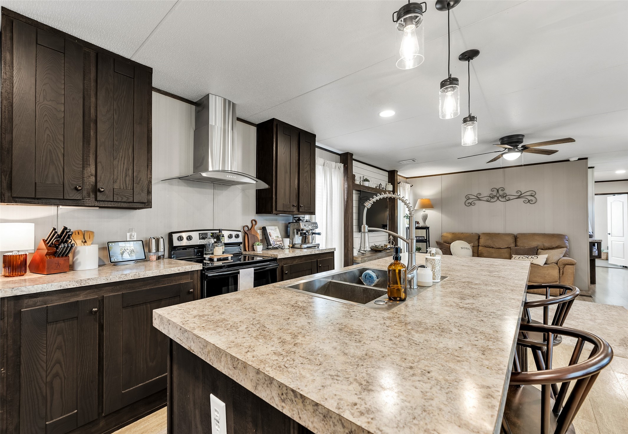 3133 Henderson Road Navasota, TX 77868 - Photo 6 of 26 a kitchen with kitchen island granite countertop a sink appliances and cabinets