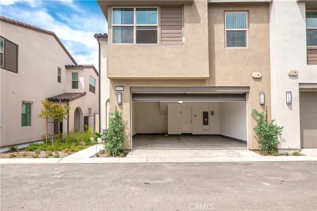a front view of a house with a garage