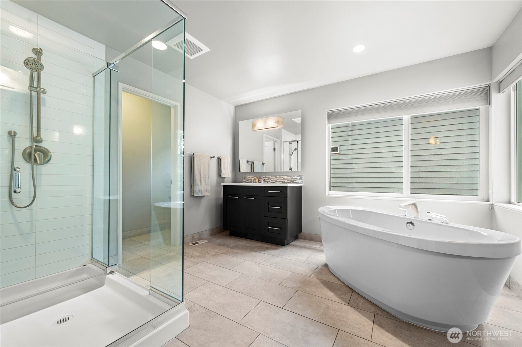 22326 2nd Place Southeast Bothell, WA 98021 - Photo 21 of 40 a bathroom with a sink a toilet and shower