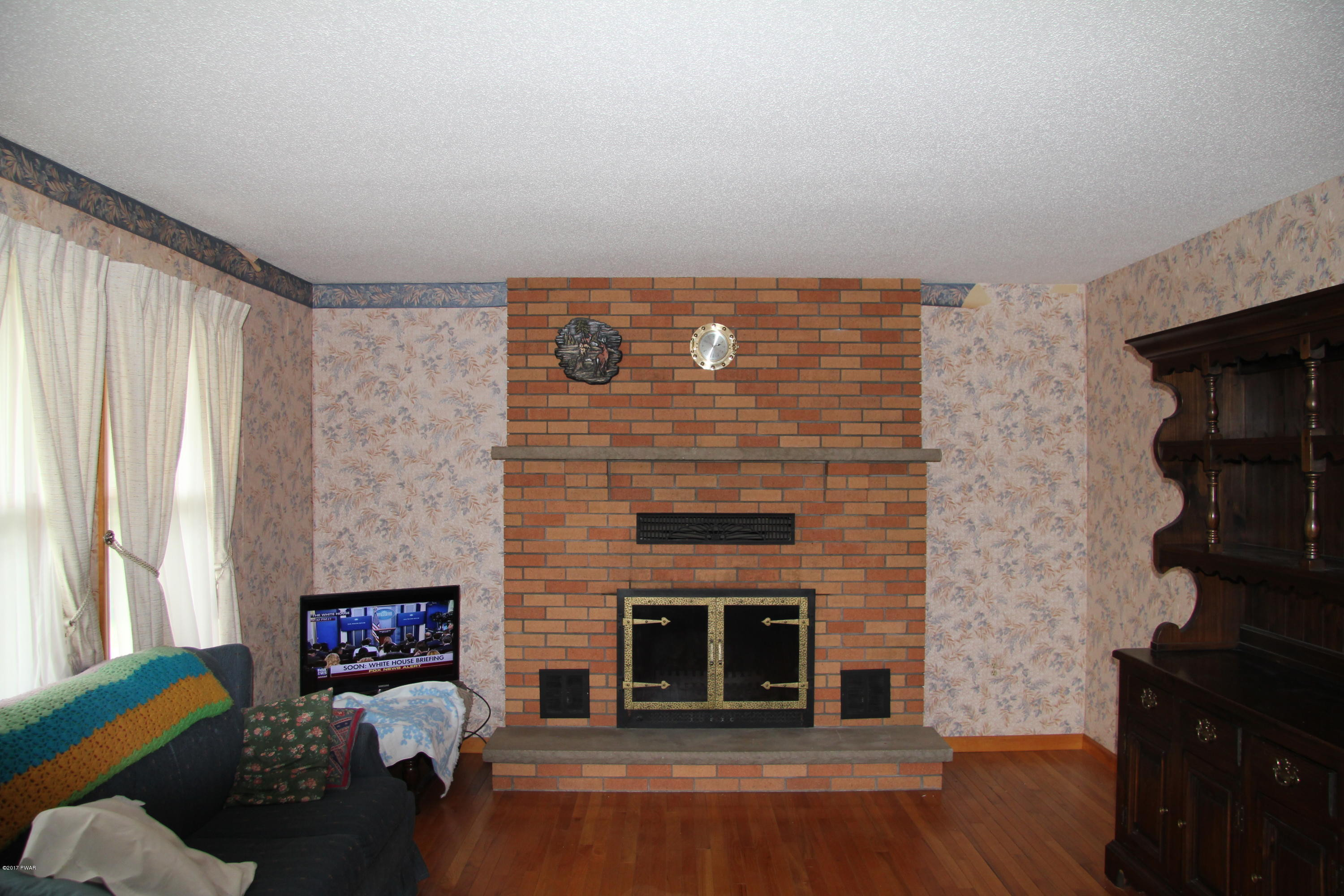 57 Burns Road Waymart, PA 18472 - Photo 5 of 20 Living Room with Brick Fireplace