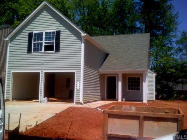 1101 Lombar Street Raleigh, NC 27610 - Photo 1 of 4 a front view of a house with yard