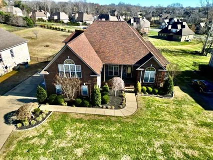 a view of a house with a yard porch and sitting area