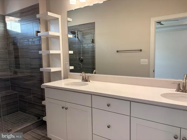 a view of an empty room with a kitchen