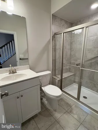 a kitchen with stainless steel appliances kitchen island a refrigerator sink and stove