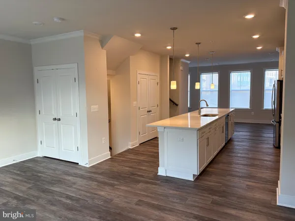 a view of a dining room with furniture and window