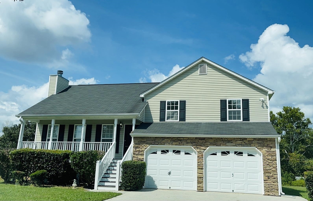 130 Bookout Loop Powder Springs, GA 30127 - Photo 1 of 1 a front view of a house with garden