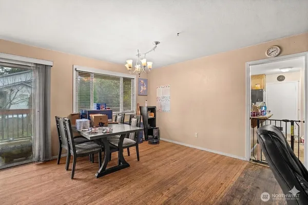 a view of a dining room with furniture and wooden floor