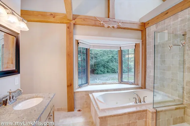 a bathroom with a tub and a sink
