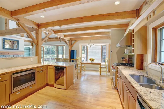 a kitchen with stainless steel appliances granite countertop a stove and a sink