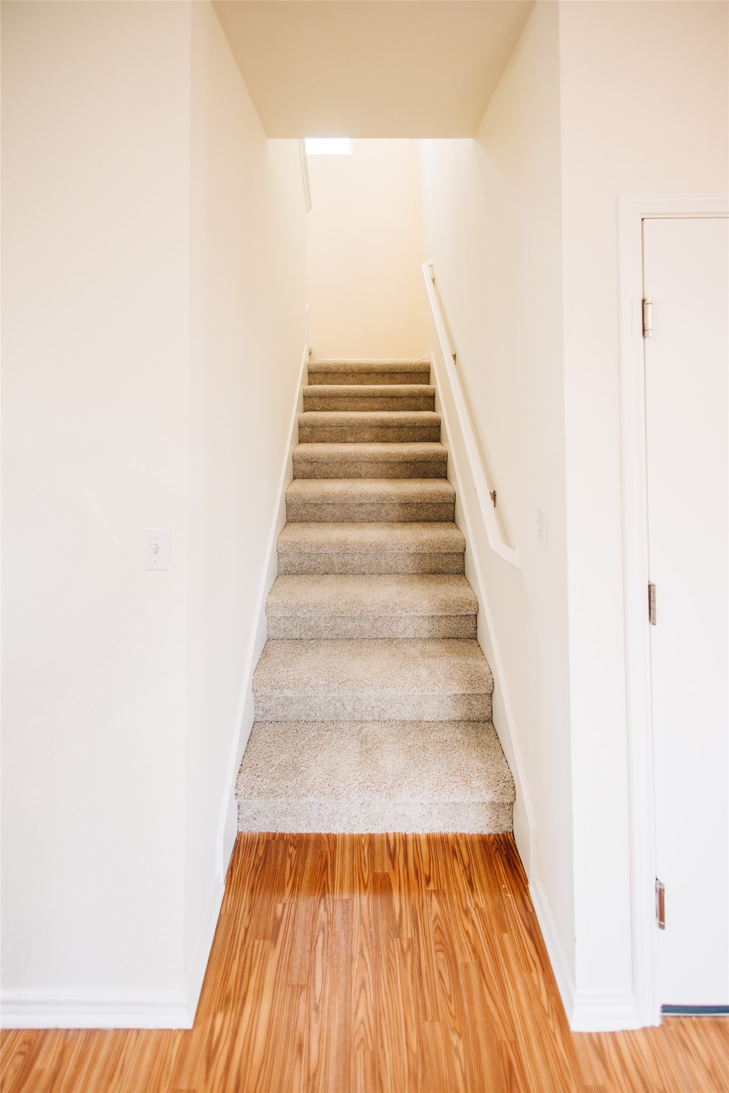 2905 Acopio Bend Austin, TX 78745 - Photo 12 of 29 Staircase featuring wood finished floors and baseboards