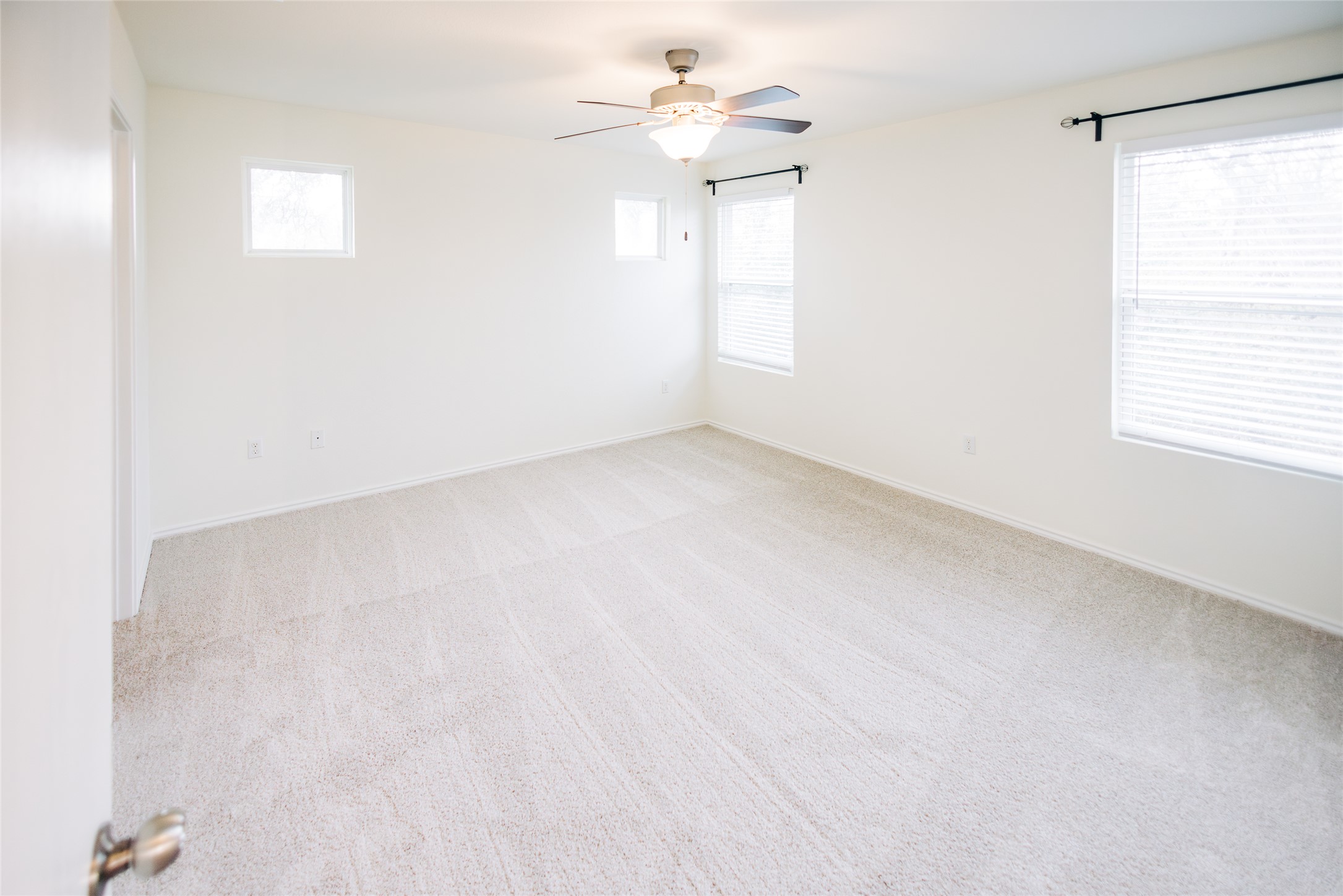 2905 Acopio Bend Austin, TX 78745 - Photo 13 of 29 Carpeted empty room featuring plenty of natural light and ceiling fan