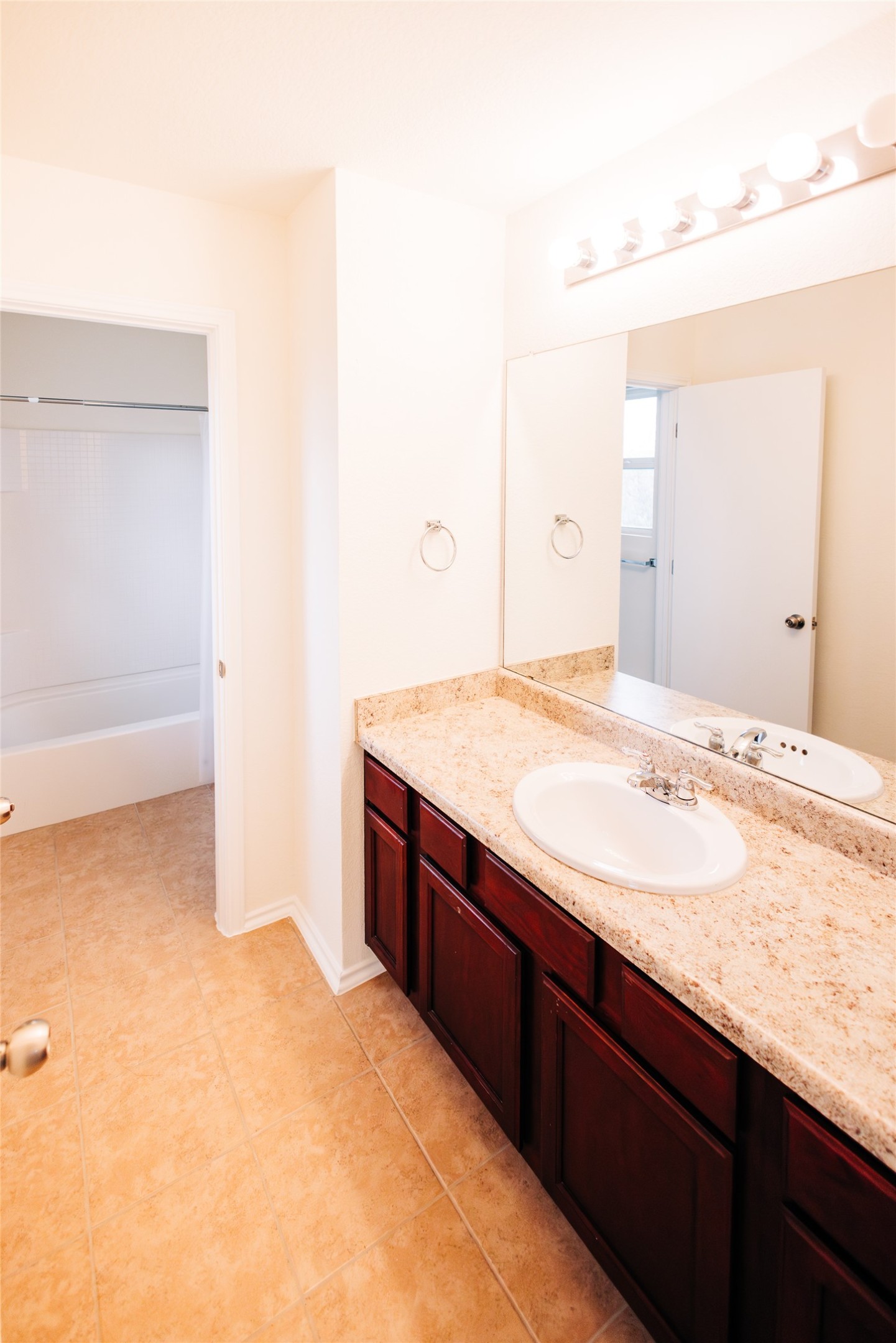 2905 Acopio Bend Austin, TX 78745 - Photo 16 of 29 Bathroom with vanity, shower / washtub combination, and light tile patterned floors