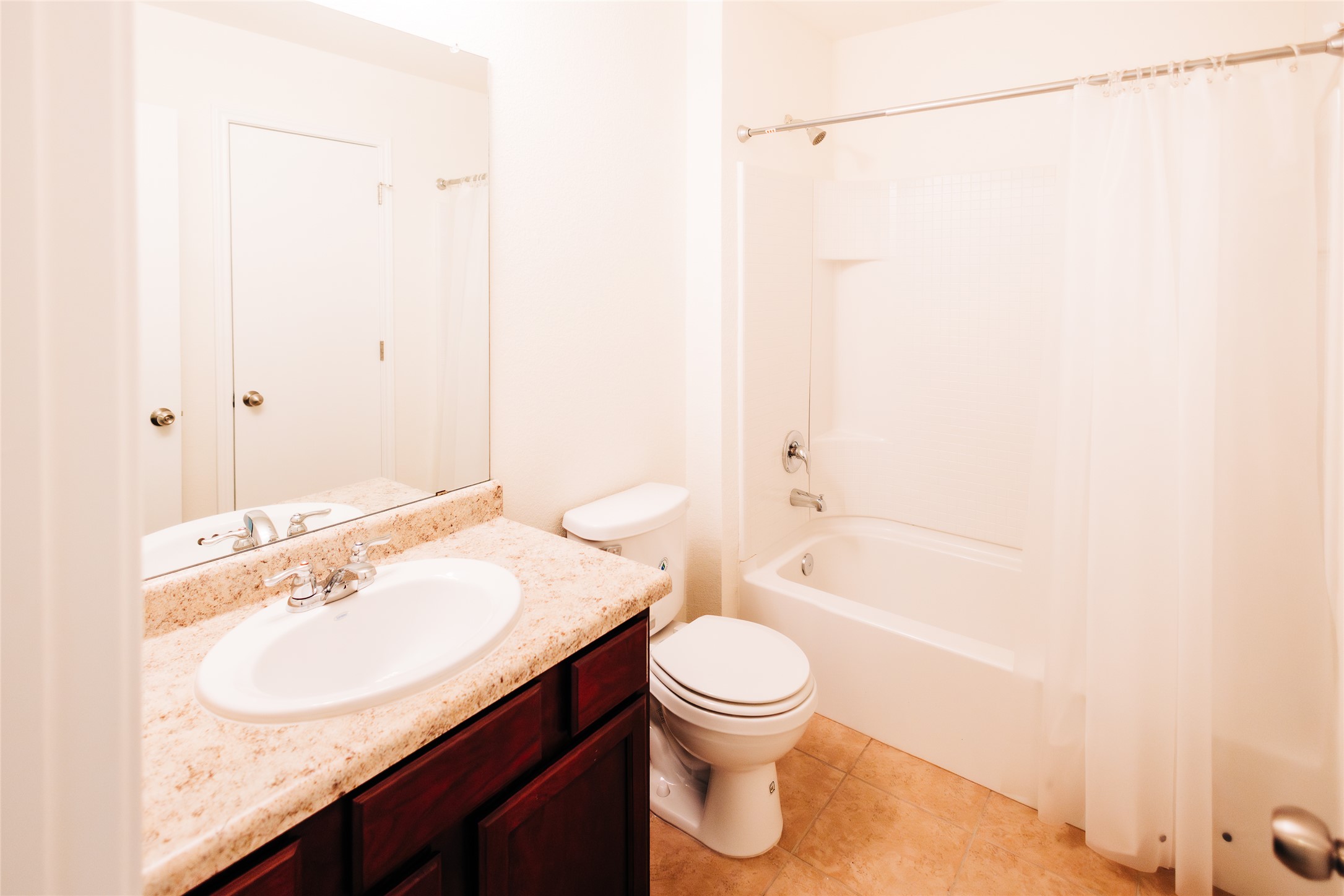 2905 Acopio Bend Austin, TX 78745 - Photo 20 of 29 Bathroom with vanity, shower / bath combo, and light tile patterned floors