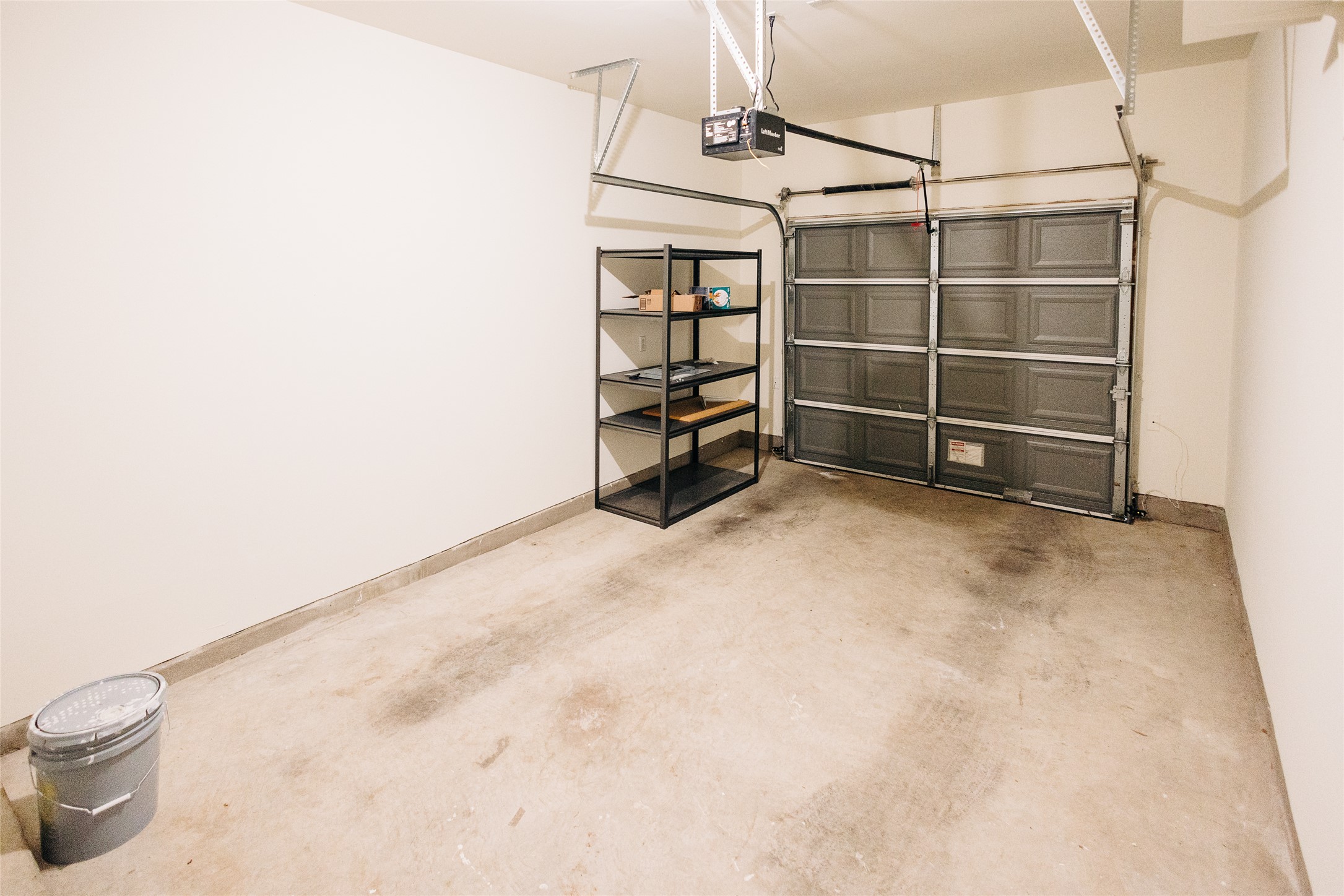 2905 Acopio Bend Austin, TX 78745 - Photo 29 of 29 Garage with a garage door opener and baseboards