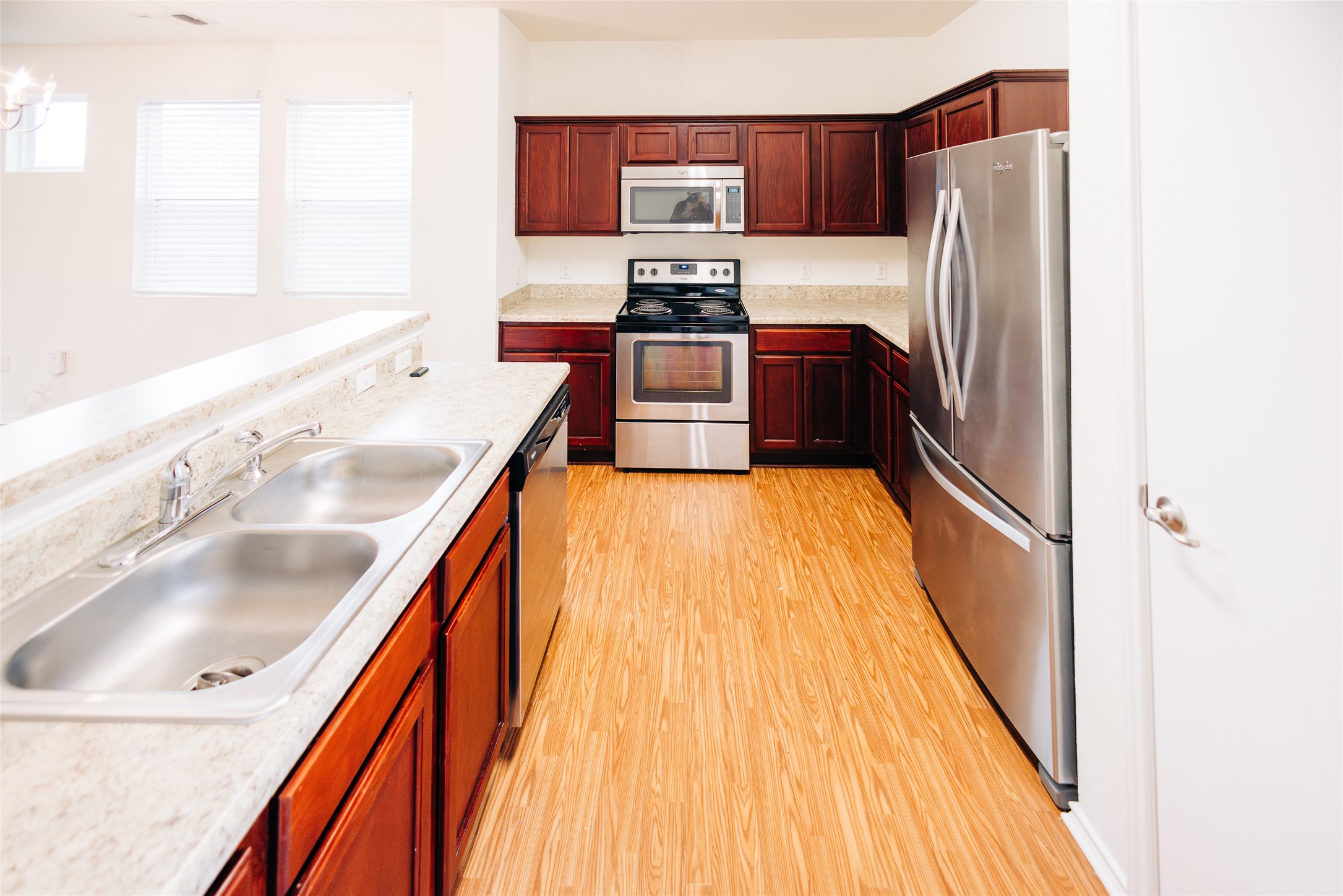 2905 Acopio Bend Austin, TX 78745 - Photo 7 of 29 Kitchen with stainless steel appliances and light wood-type flooring