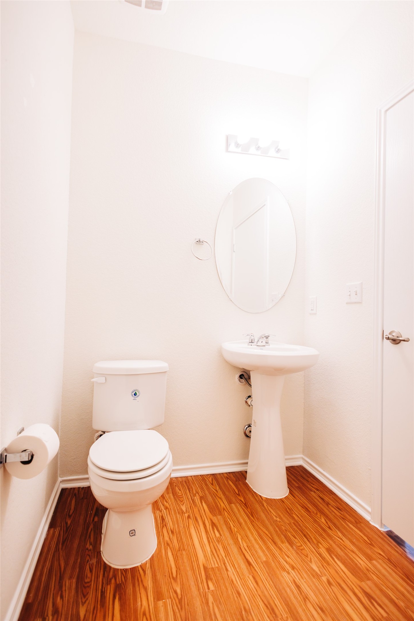 2905 Acopio Bend Austin, TX 78745 - Photo 10 of 29 Half bath featuring light wood-style flooring and toilet